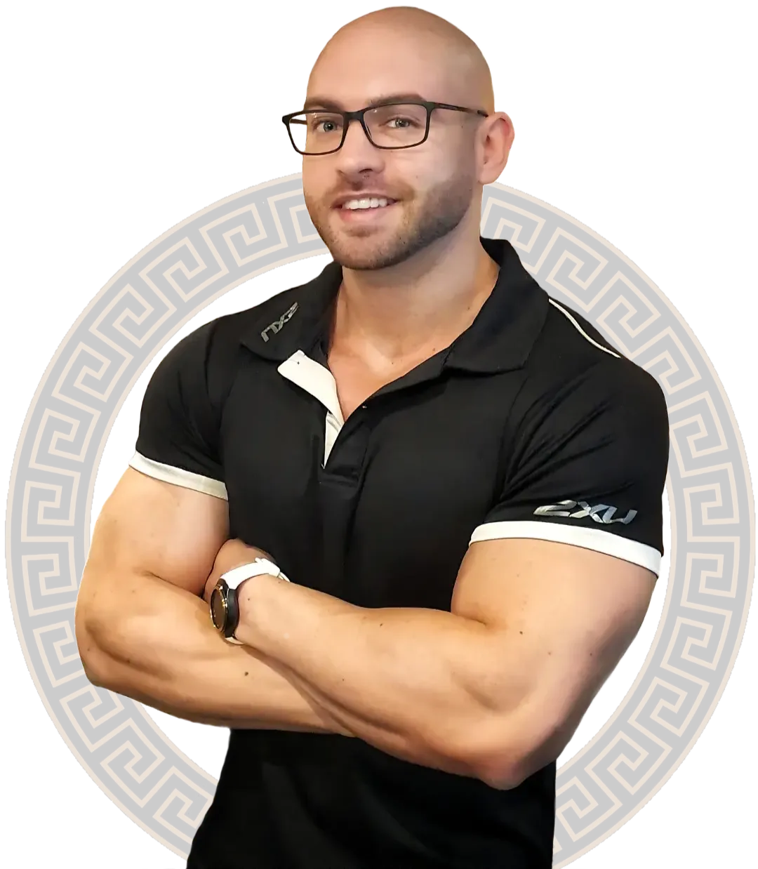 Portrait of Isaac Furlani: arms folded, in glasses and a black training polo, set against the practice's Greek-key ring.